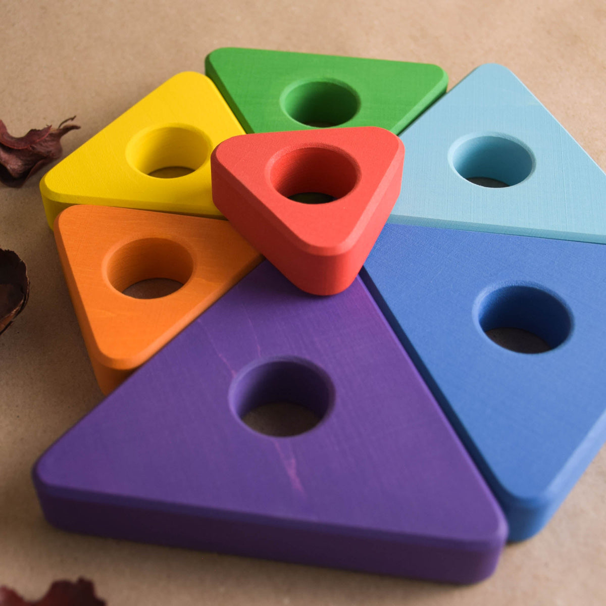 Wooden ring stacker with triangular rings