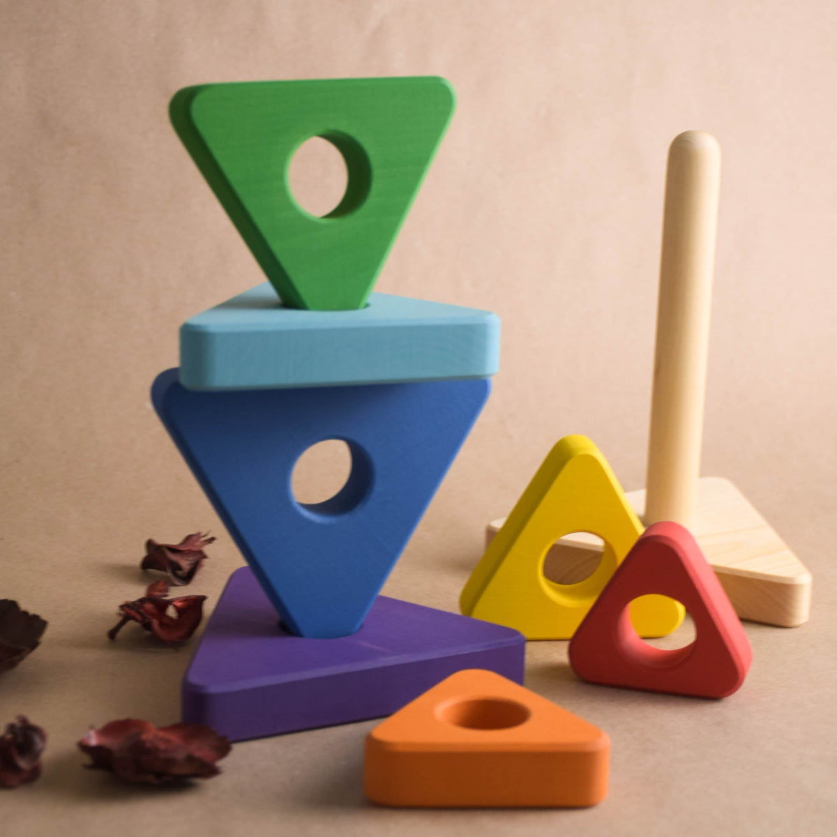 Wooden ring stacker with triangular rings