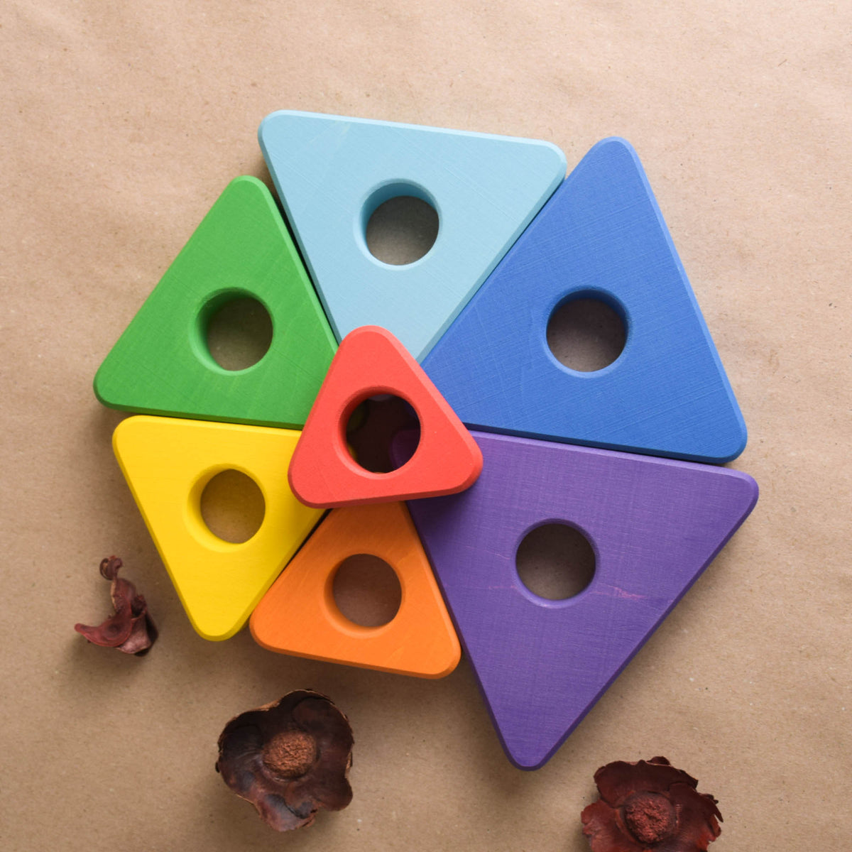 Stacking toy with triangular rings made from wood