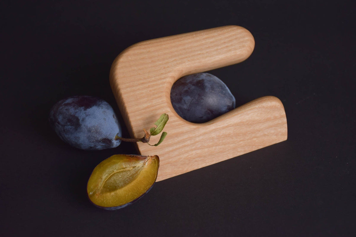 Handmade Montessori cutting knife in solid ash wood with a natural oil finish