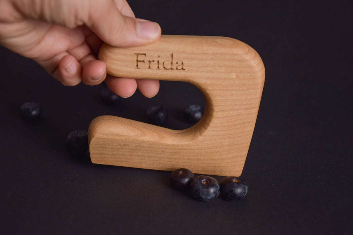 Handmade Montessori cutting knife in solid ash wood with a natural oil finish