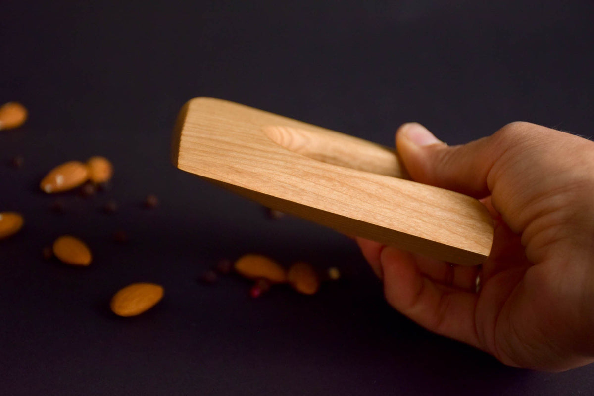 Handmade Montessori cutting knife in solid ash wood with a natural oil finish