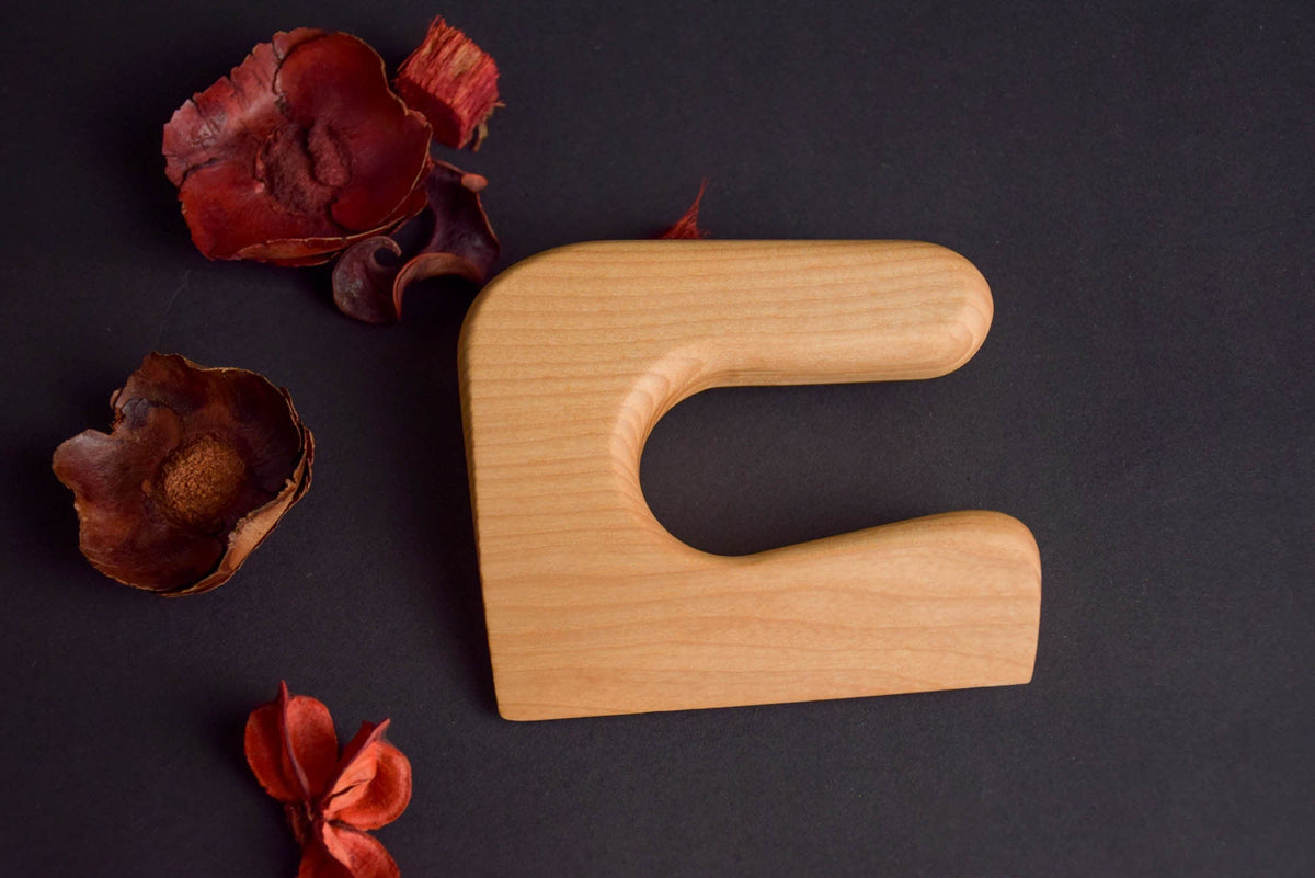 Handmade Montessori cutting knife in solid ash wood with a natural oil finish