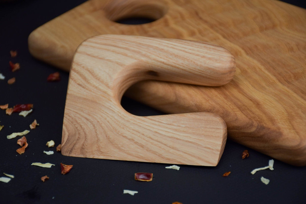 Handmade Montessori cutting knife in solid ash wood with a natural oil finish