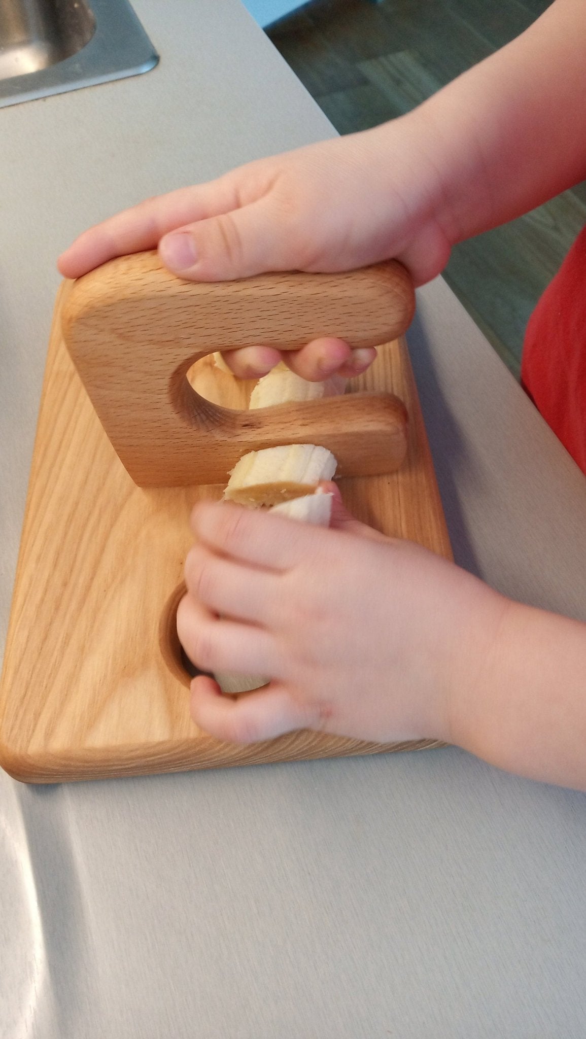 Handmade Montessori cutting knife in solid ash wood with a natural oil finish