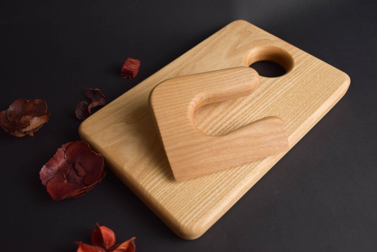 Handmade Montessori knife and cutting board set in solid ash wood with a natural oil finish