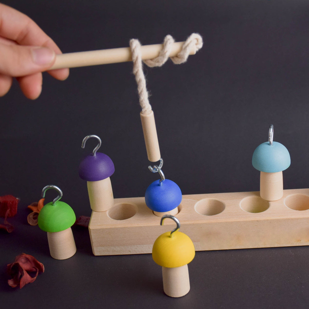 Fishing rod game with mushroom balancing pieces