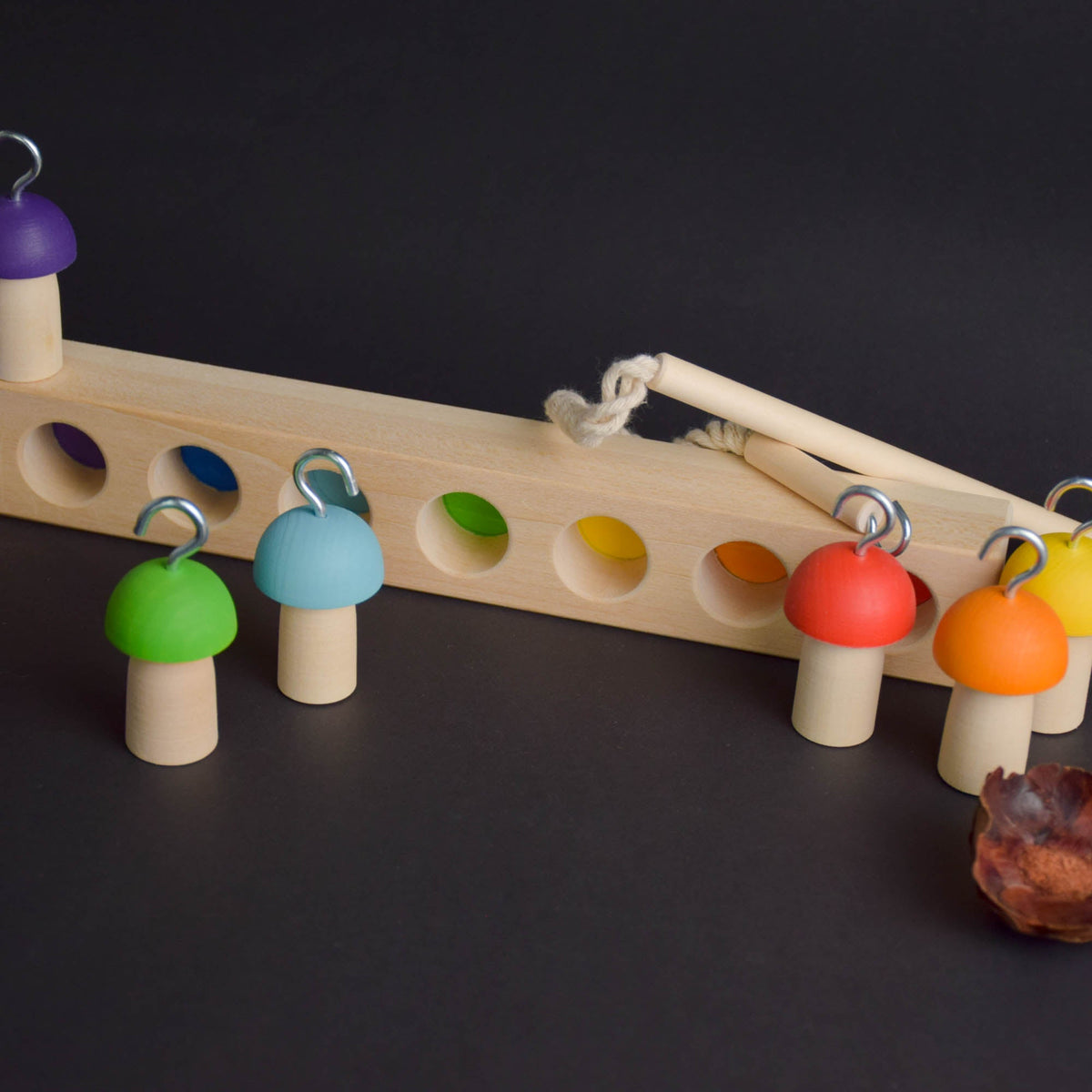 Mushroom-themed balancing toy with a fishing rod