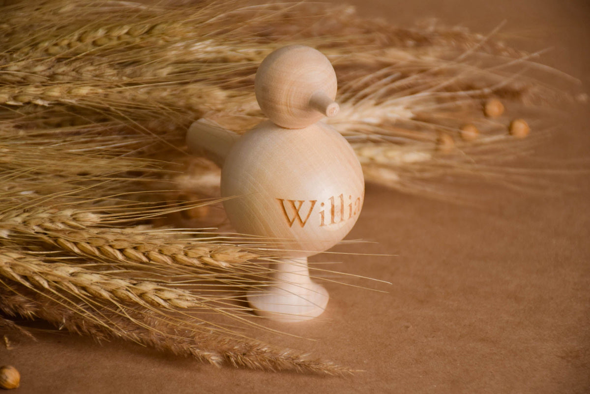 Bird-shaped wooden whistle toy
