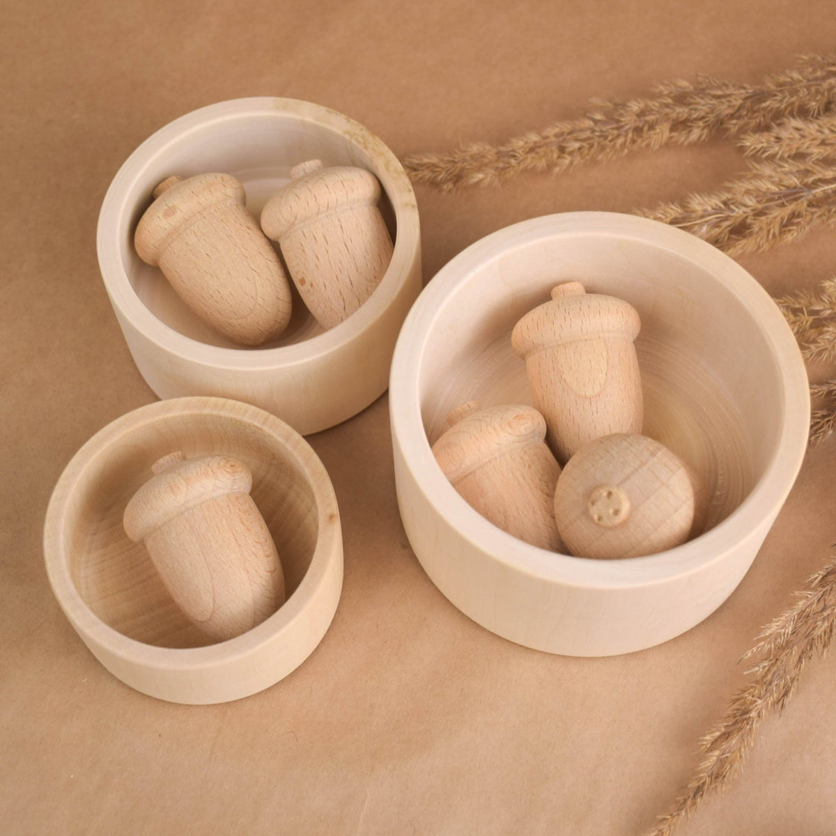 Acorn-shaped craft pieces in beech wood