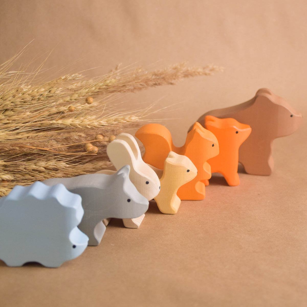 Painted wooden animals for a miniature forest