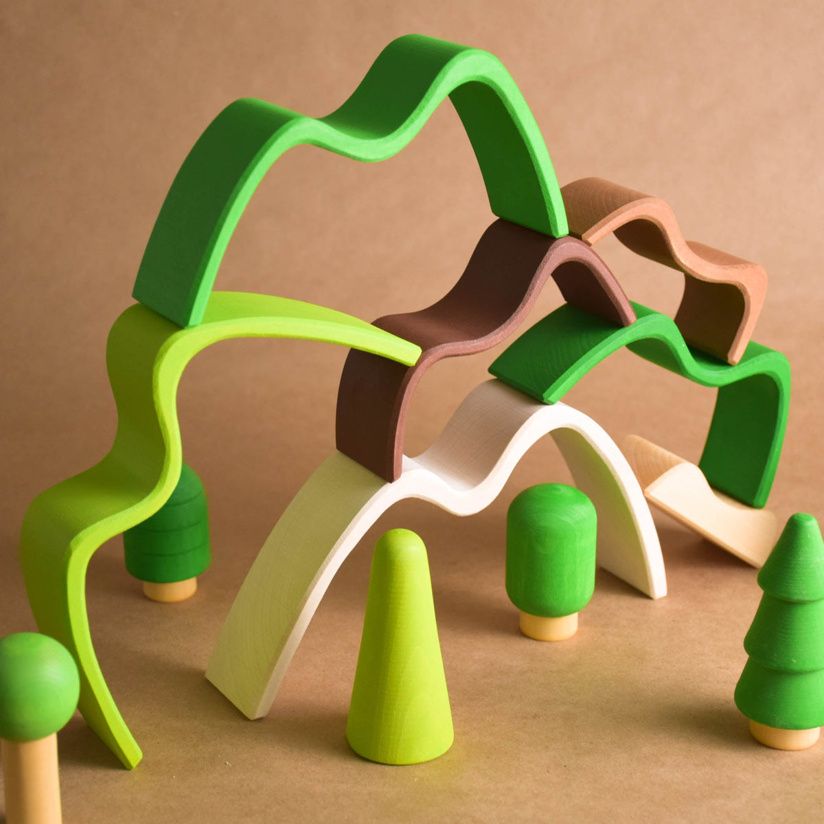 Handmade Montessori colored mountain stacking toy in linden wood with a natural wax-and-oil finish
