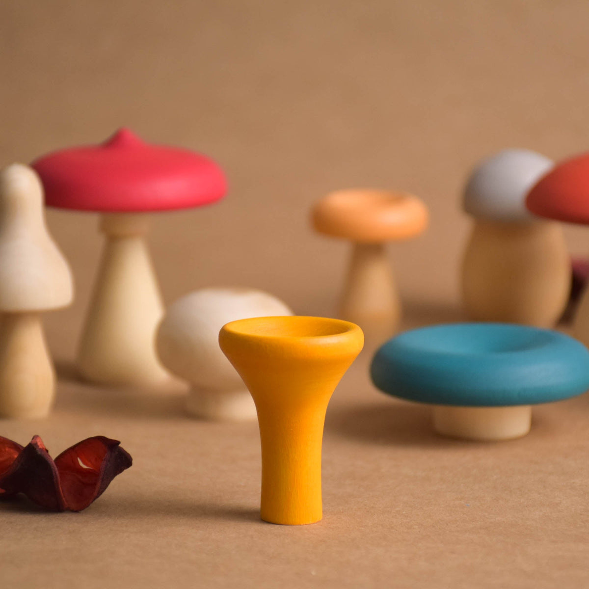 Colorful wooden mushrooms for woodland play