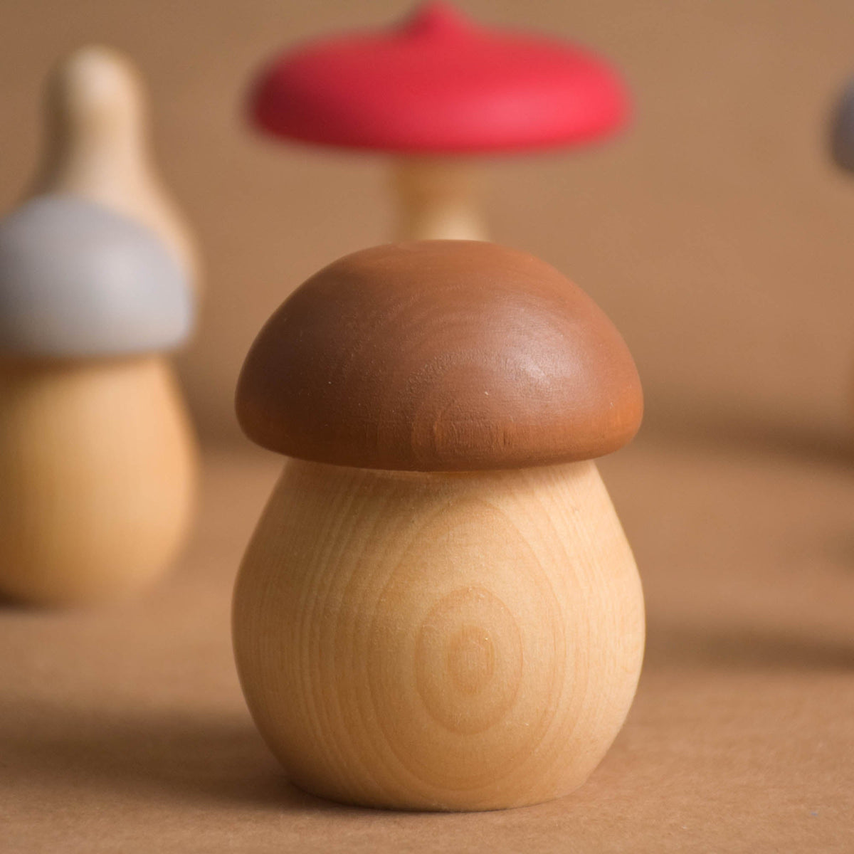 Colorful wooden mushrooms for woodland play