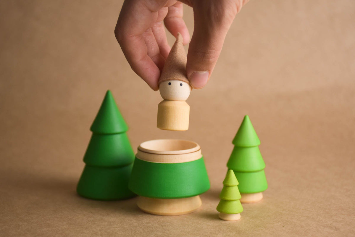 Handmade colored wooden trees and peg doll