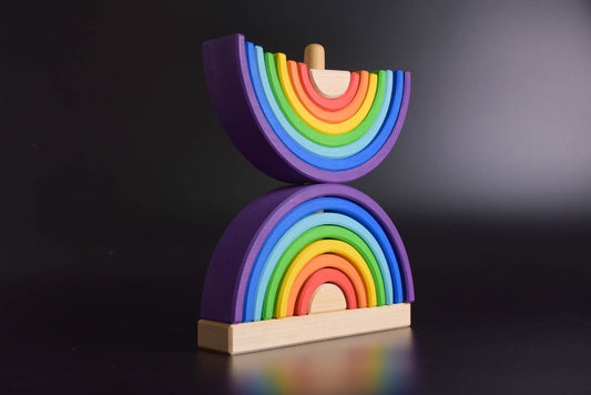Handmade Montessori double rainbow stacking toy in linden wood with a natural wax-and-oil finish