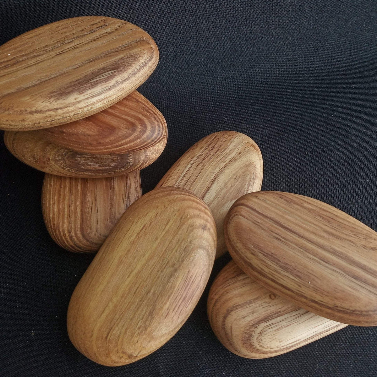 Handcrafted green acacia wooden stacking pebbles