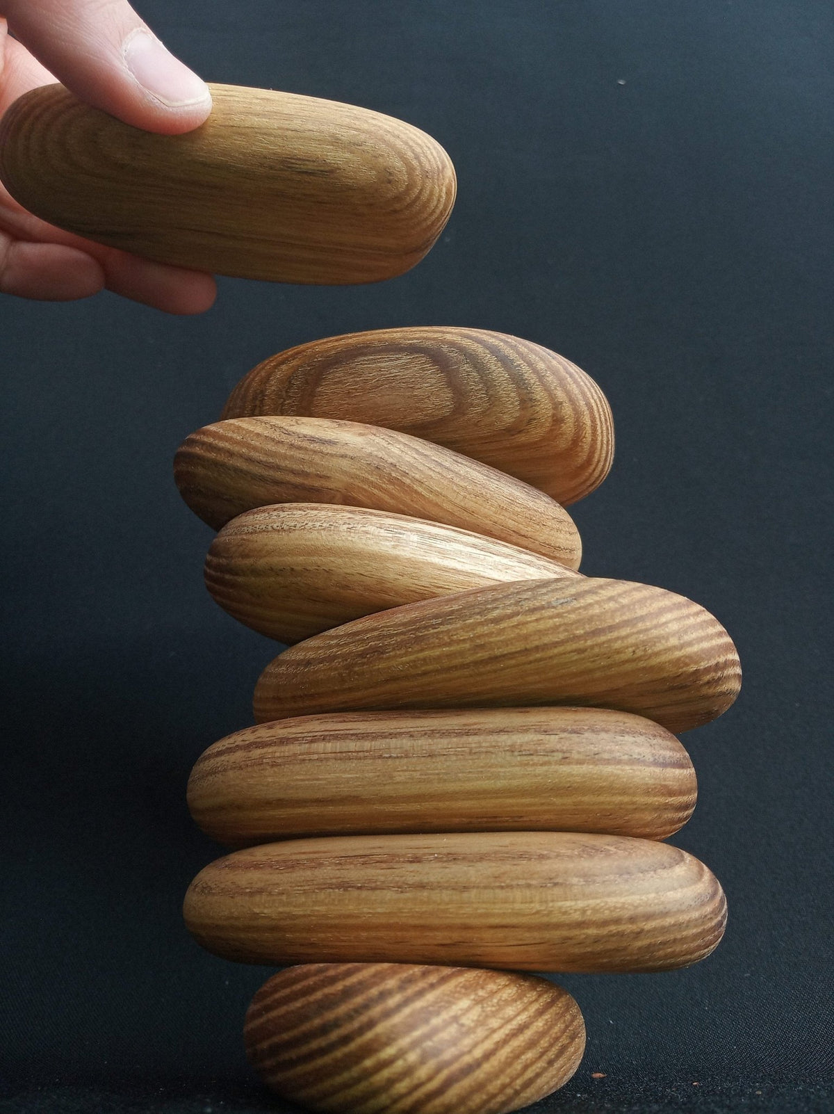 Smooth stacking stones made from green acacia wood