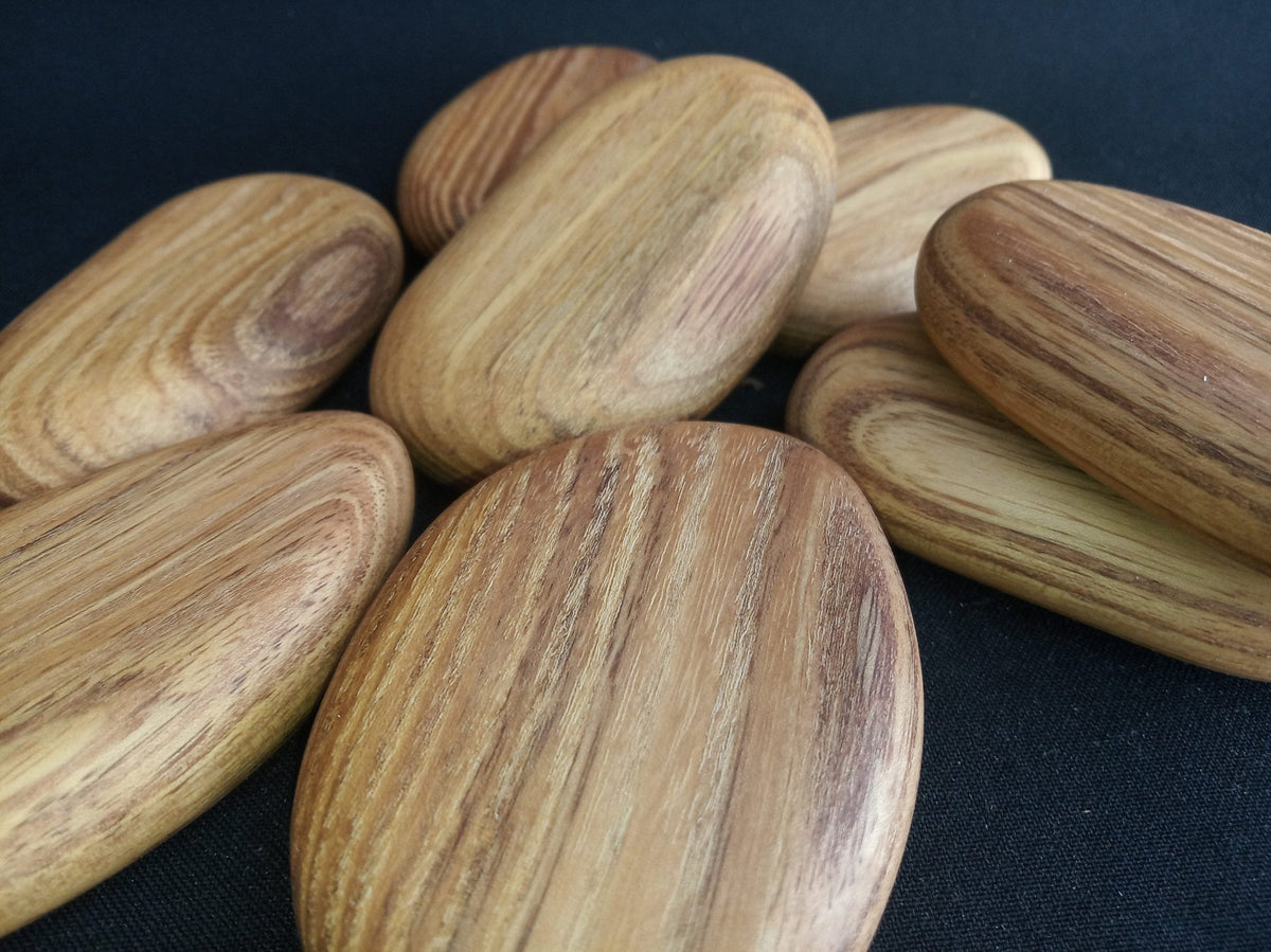 Rounded green acacia wood stacking pebbles