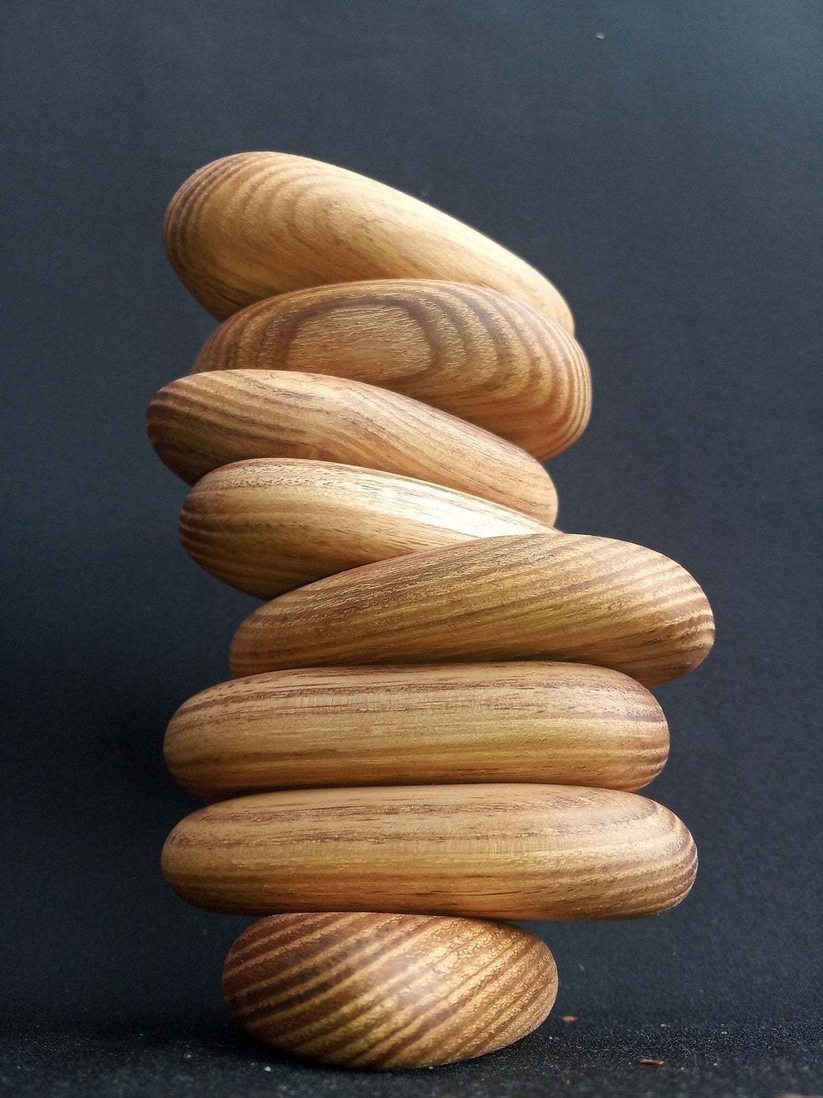 Green acacia wooden balancing pebbles