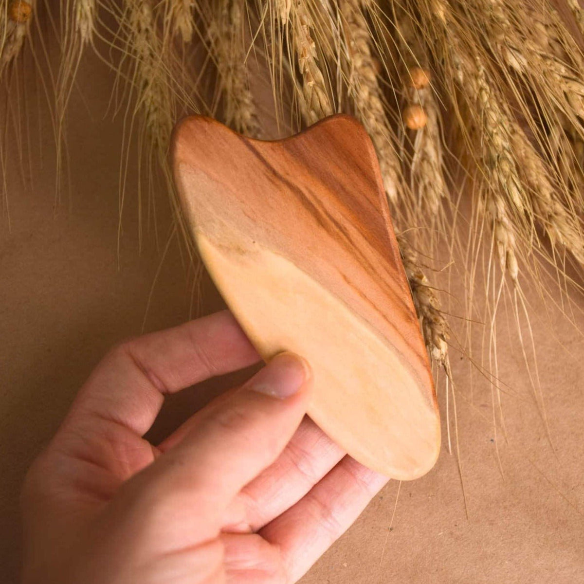 Heart-shaped elm wood gua sha tool for facial massage