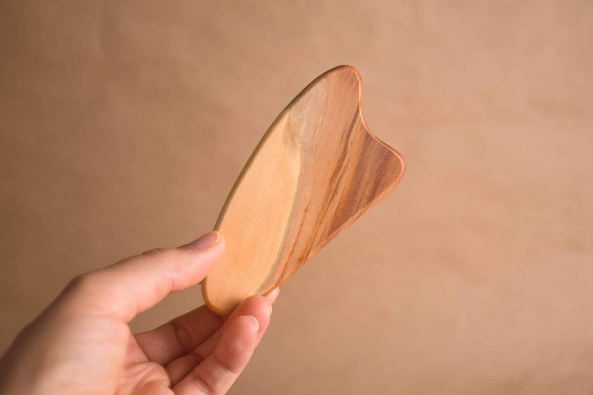 Handmade heart-shaped wooden gua sha tool