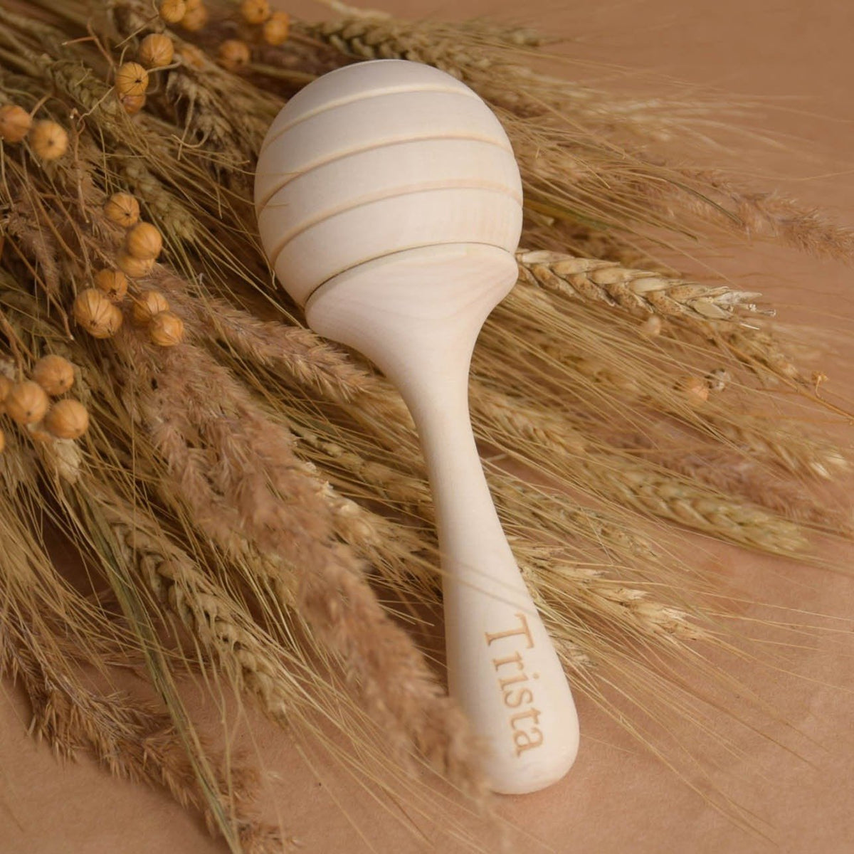 Honey wooden maraca baby rattle made from linden wood