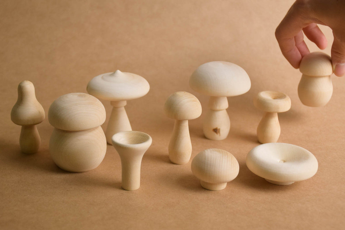Natural wood mushroom figures for imaginative play