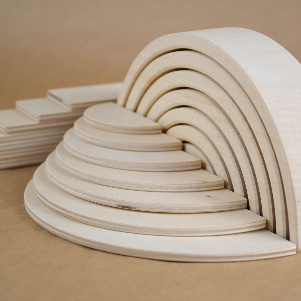 Handmade Montessori natural rainbow building toy crafted from linden wood and plywood