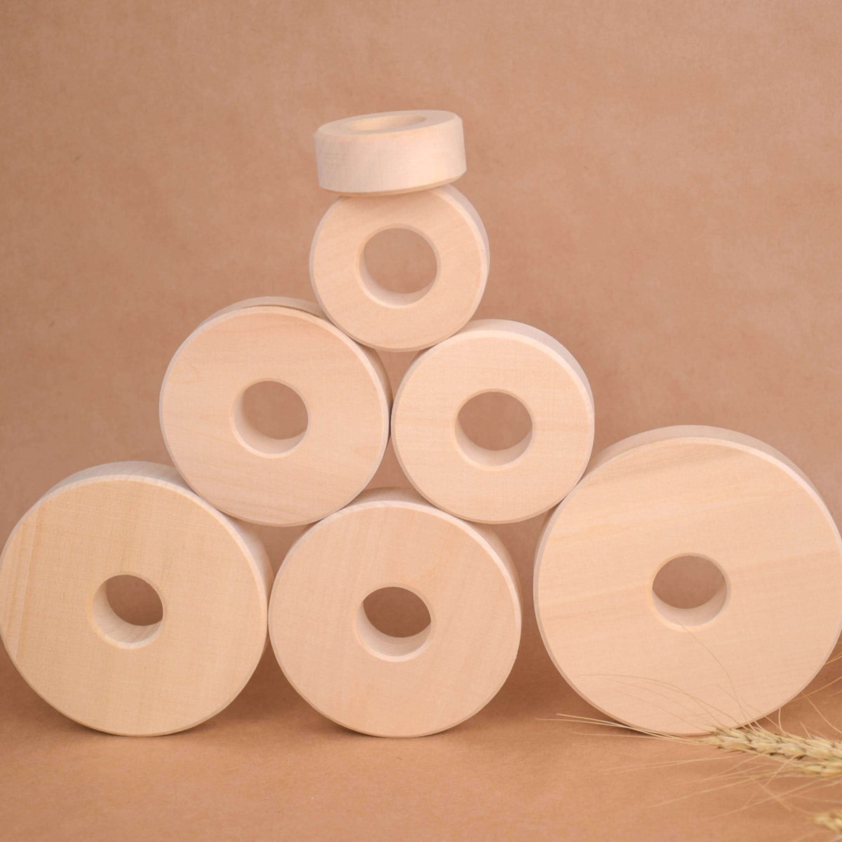 Ring stacking toy made from linden wood, with rings