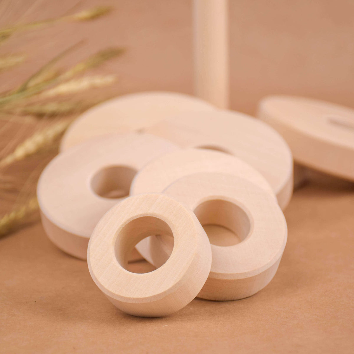 Stacking toy with rings made from linden wood