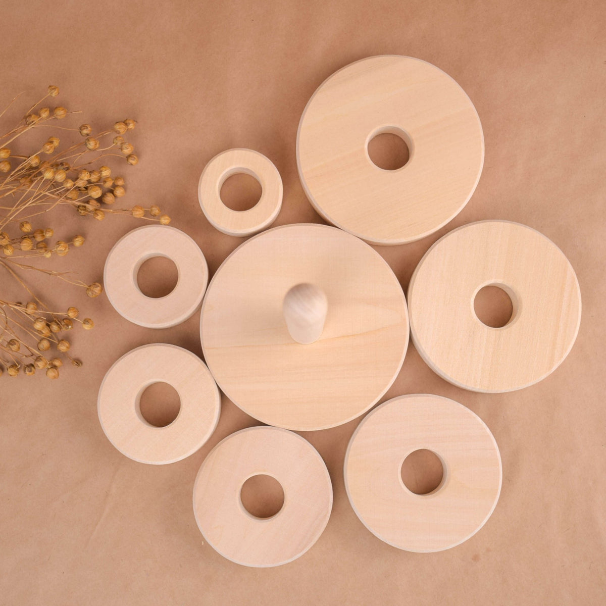 Stacking toy with rings made from linden wood