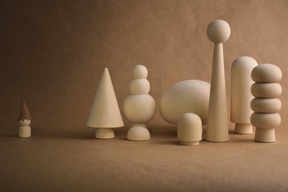 Unfinished wooden tree figures for imaginative play