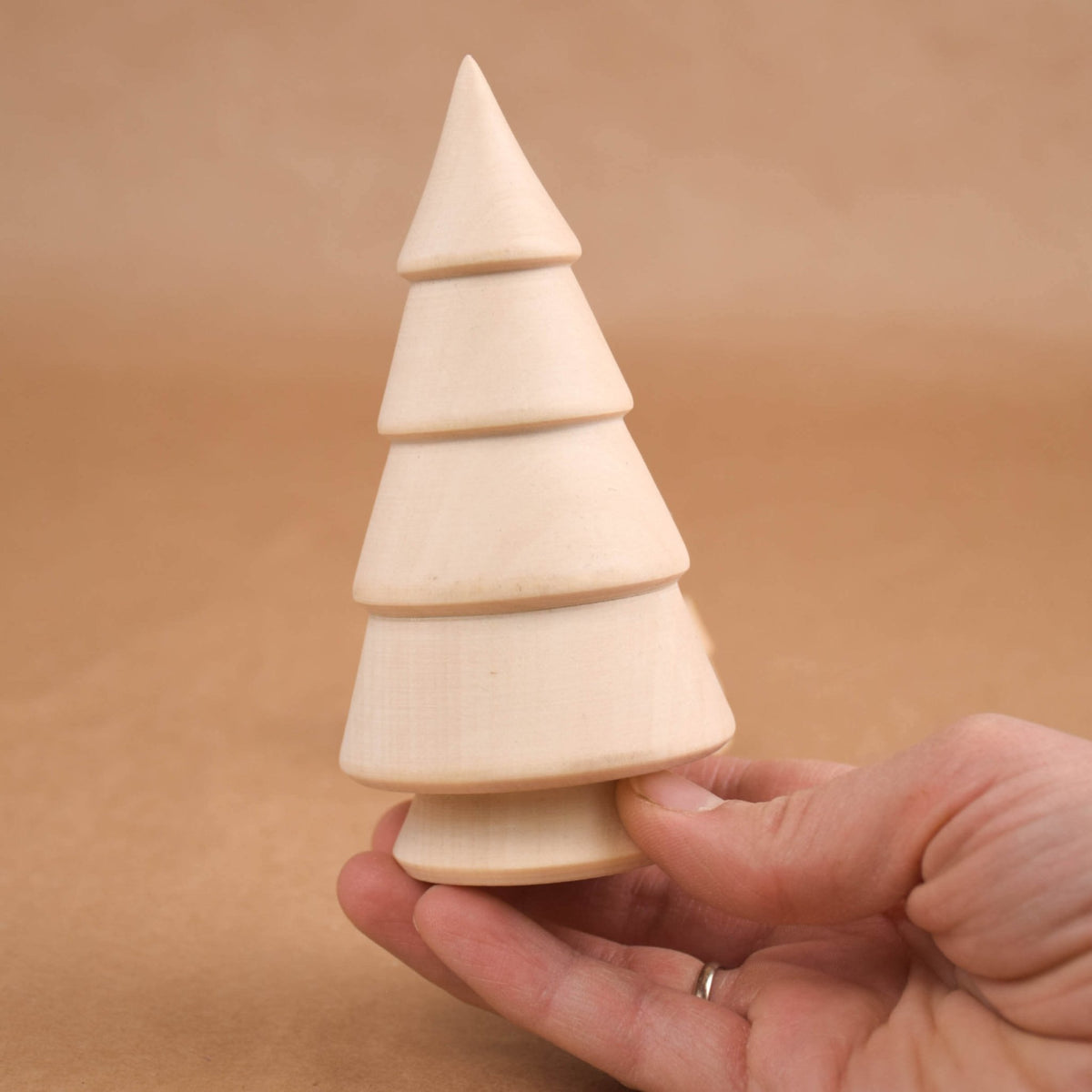 Handmade wooden trees for nature-inspired play
