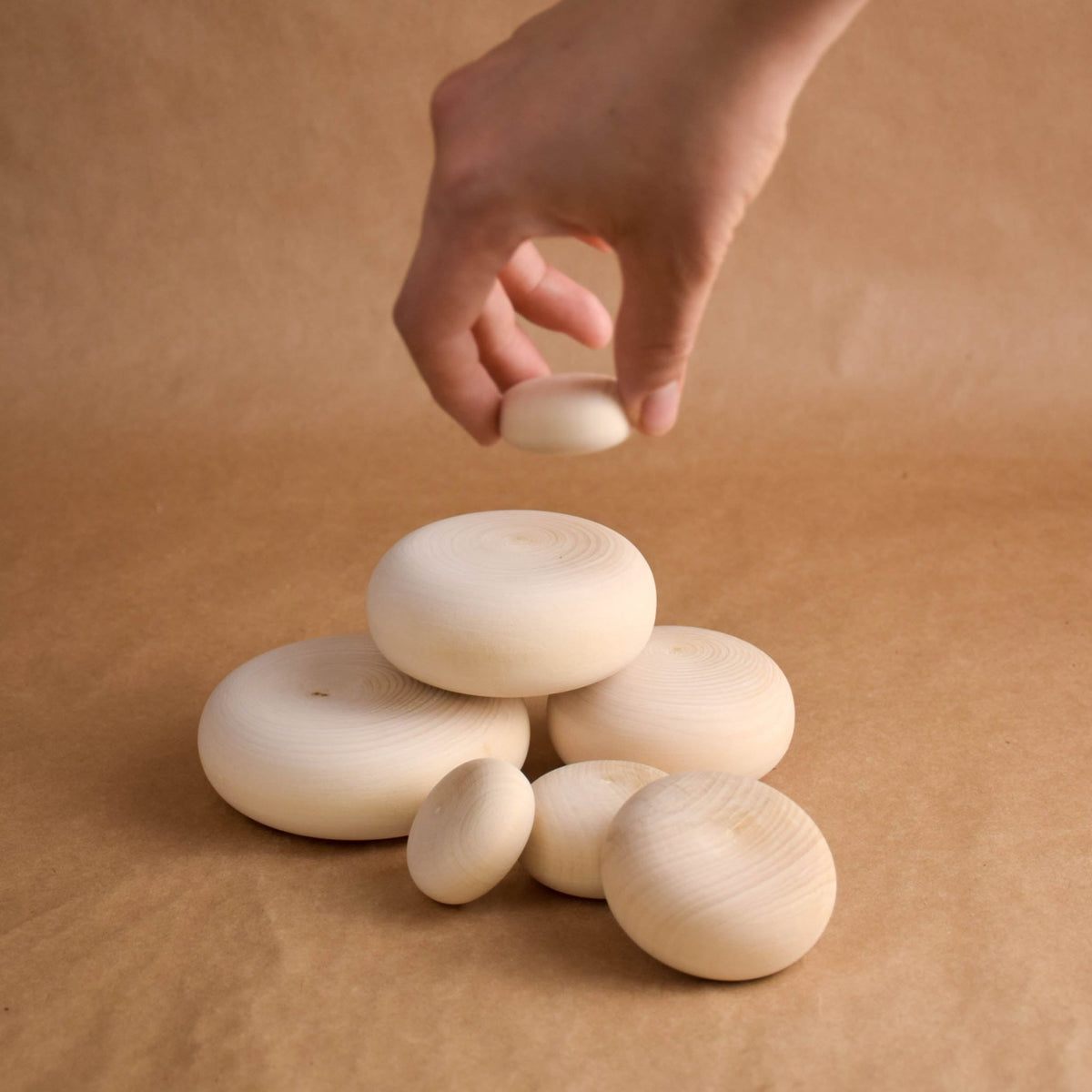 River-inspired wooden stacking stones