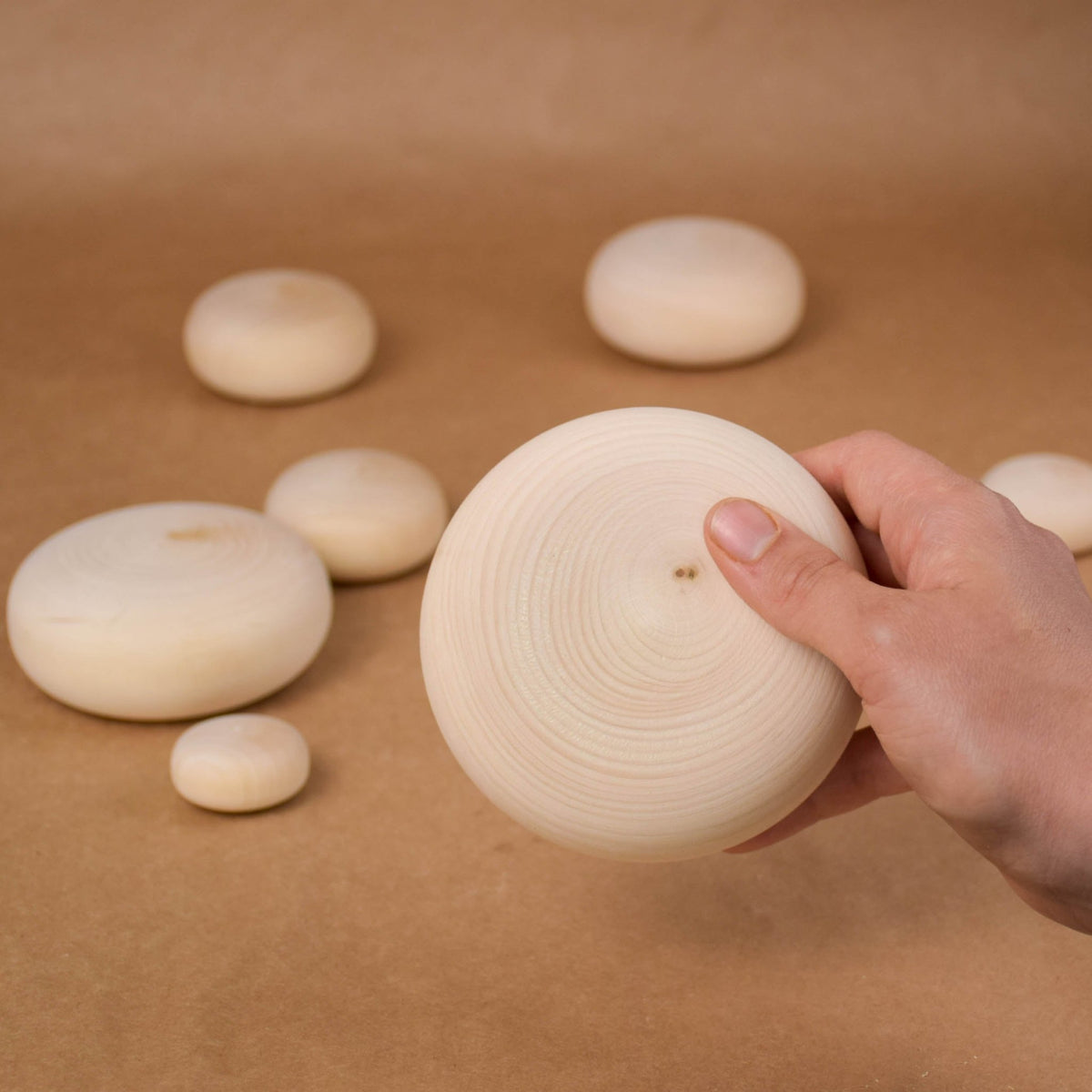 Pebble-shaped wooden blocks for stacking