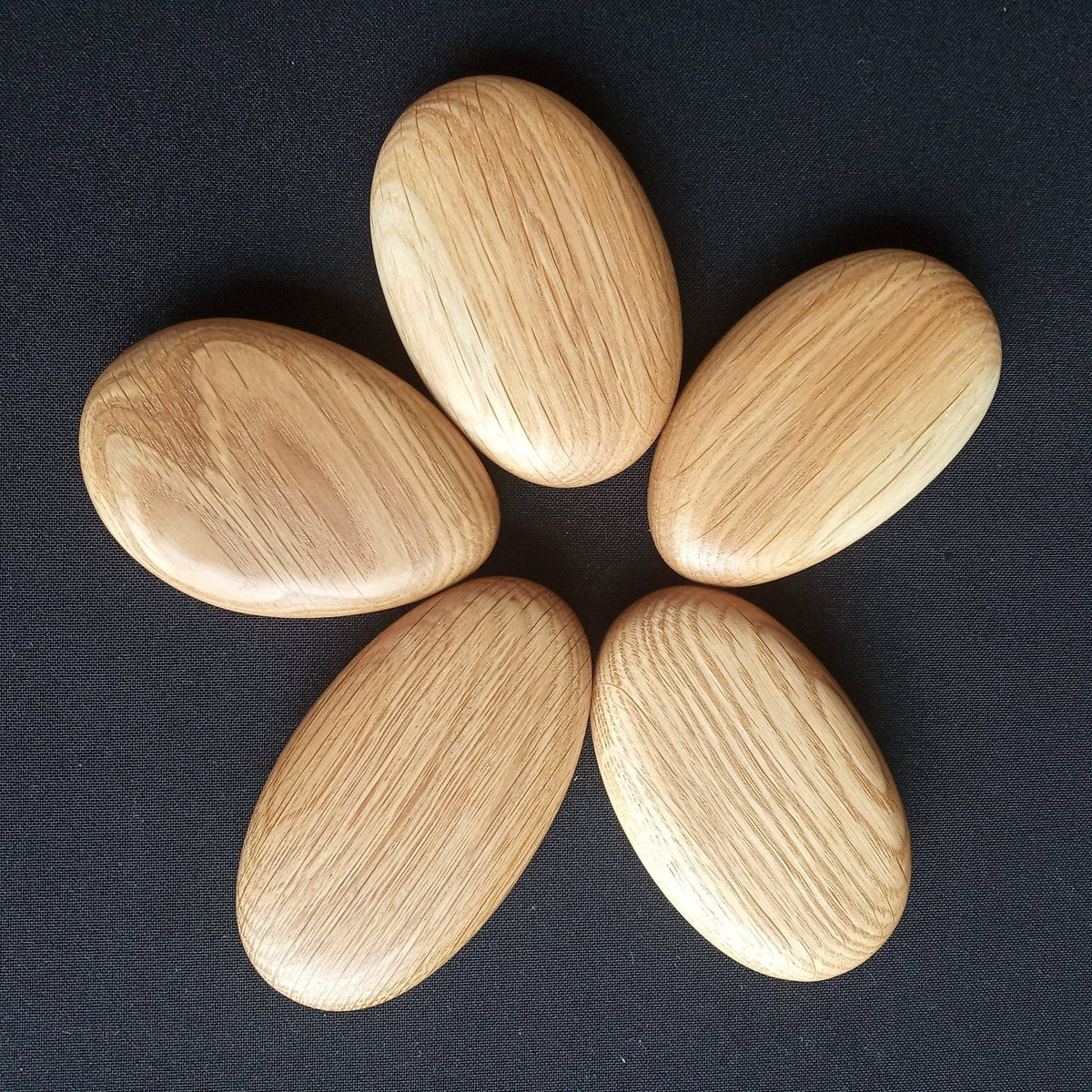 Smooth pebble-shaped blocks made from pedunculate oak
