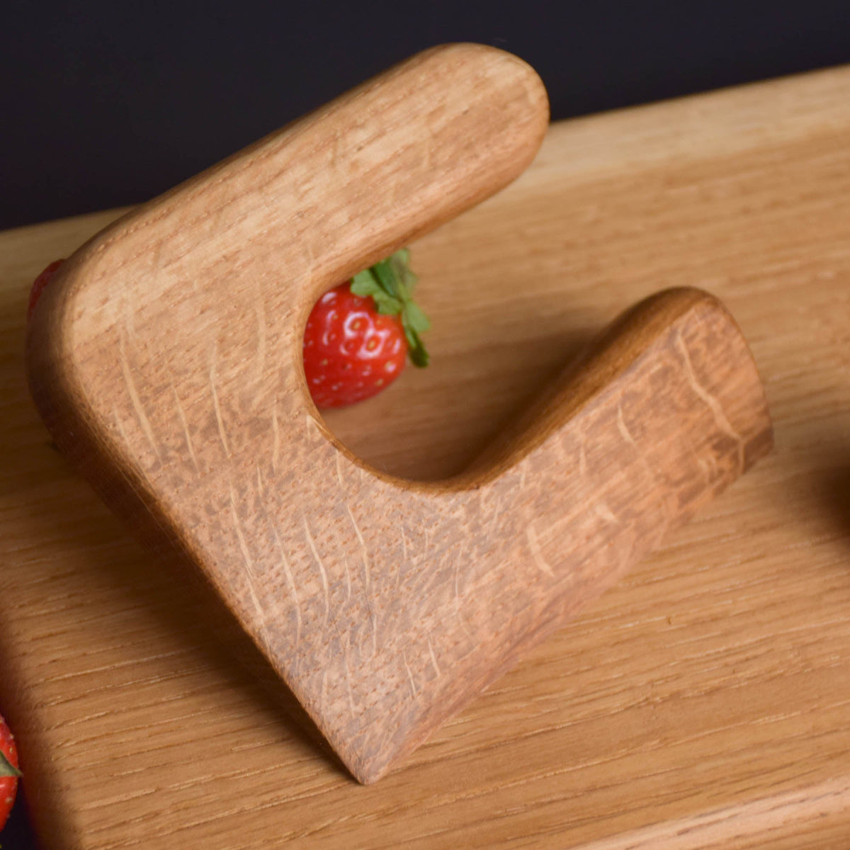 Handmade Montessori knife and cutting board set in solid oak wood with a natural oil finish