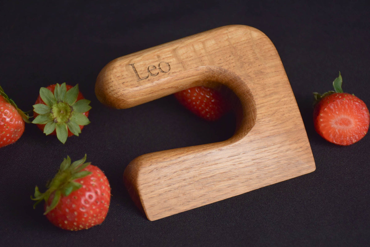 Handmade Montessori knife and cutting board set in solid oak wood with a natural oil finish