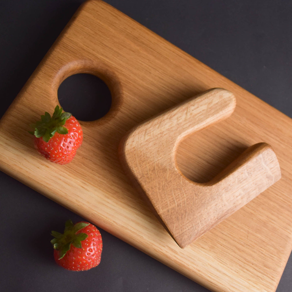 Handmade Montessori knife and cutting board set in solid oak wood with a natural oil finish
