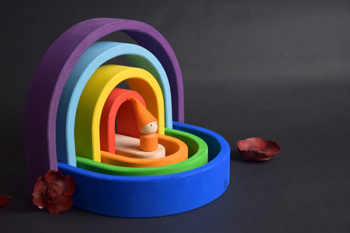 Handmade Montessori oval rainbow stacker in linden wood with a natural colored wax-and-oil finish