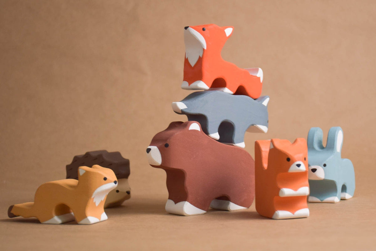 Seven painted wooden forest animal figures