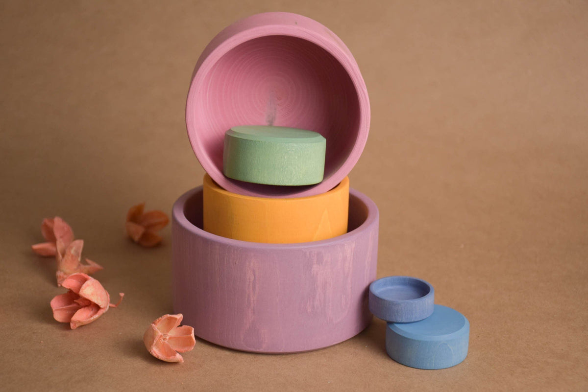Wooden nesting bowls in pastel colors
