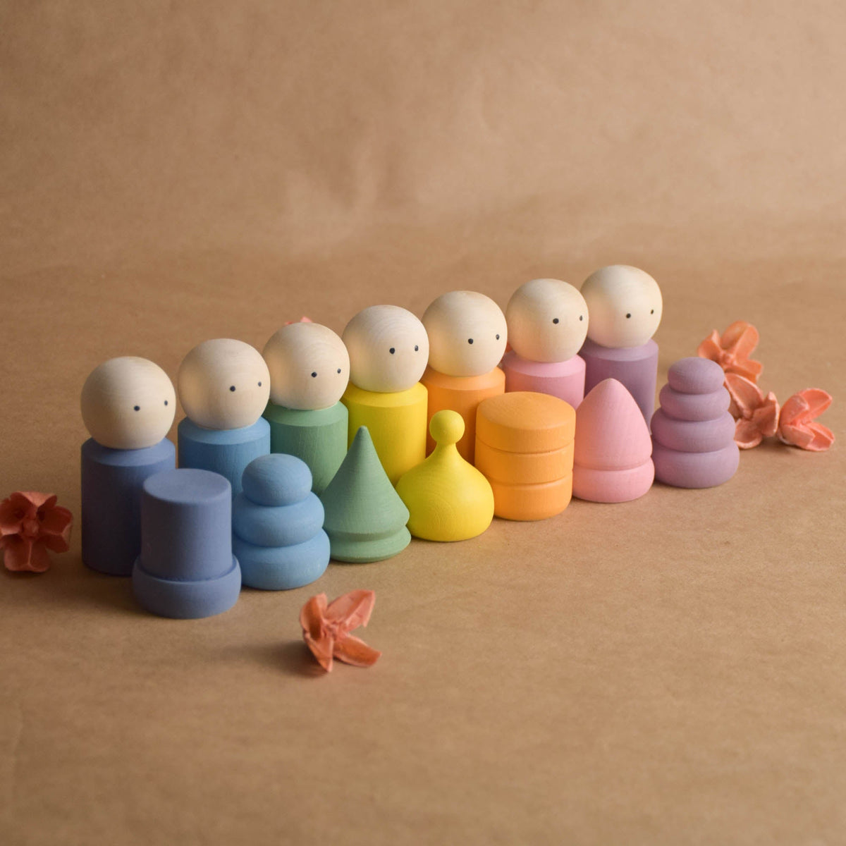 Wooden peg doll set with soft pastel hats