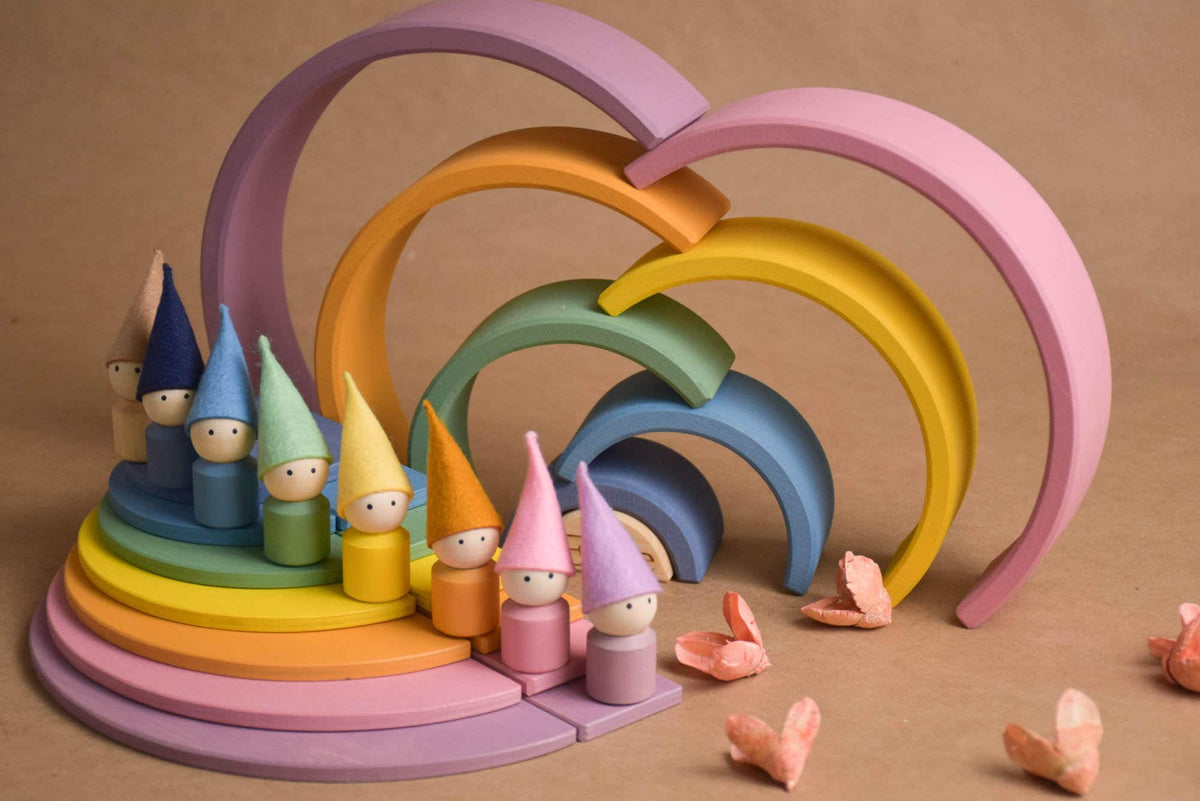 Handmade Montessori pastel rainbow building toy in wood and plywood with a natural wax-and-oil finish