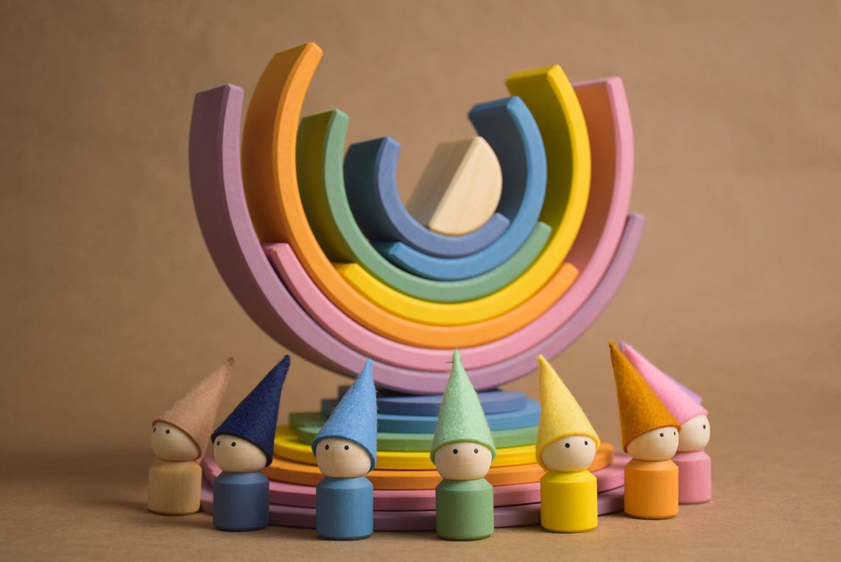 Handmade Montessori pastel rainbow building toy in wood and plywood with a natural wax-and-oil finish