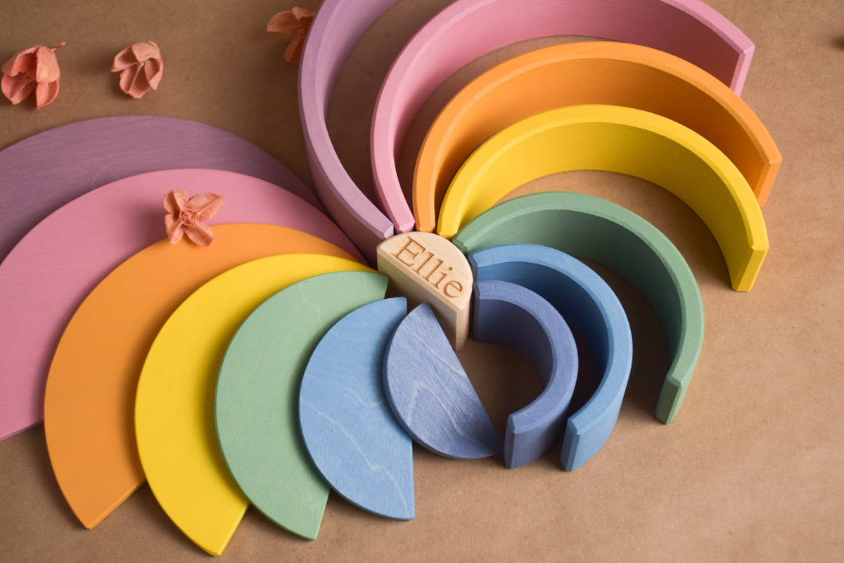 Handmade Montessori pastel rainbow building toy in wood and plywood with a natural wax-and-oil finish