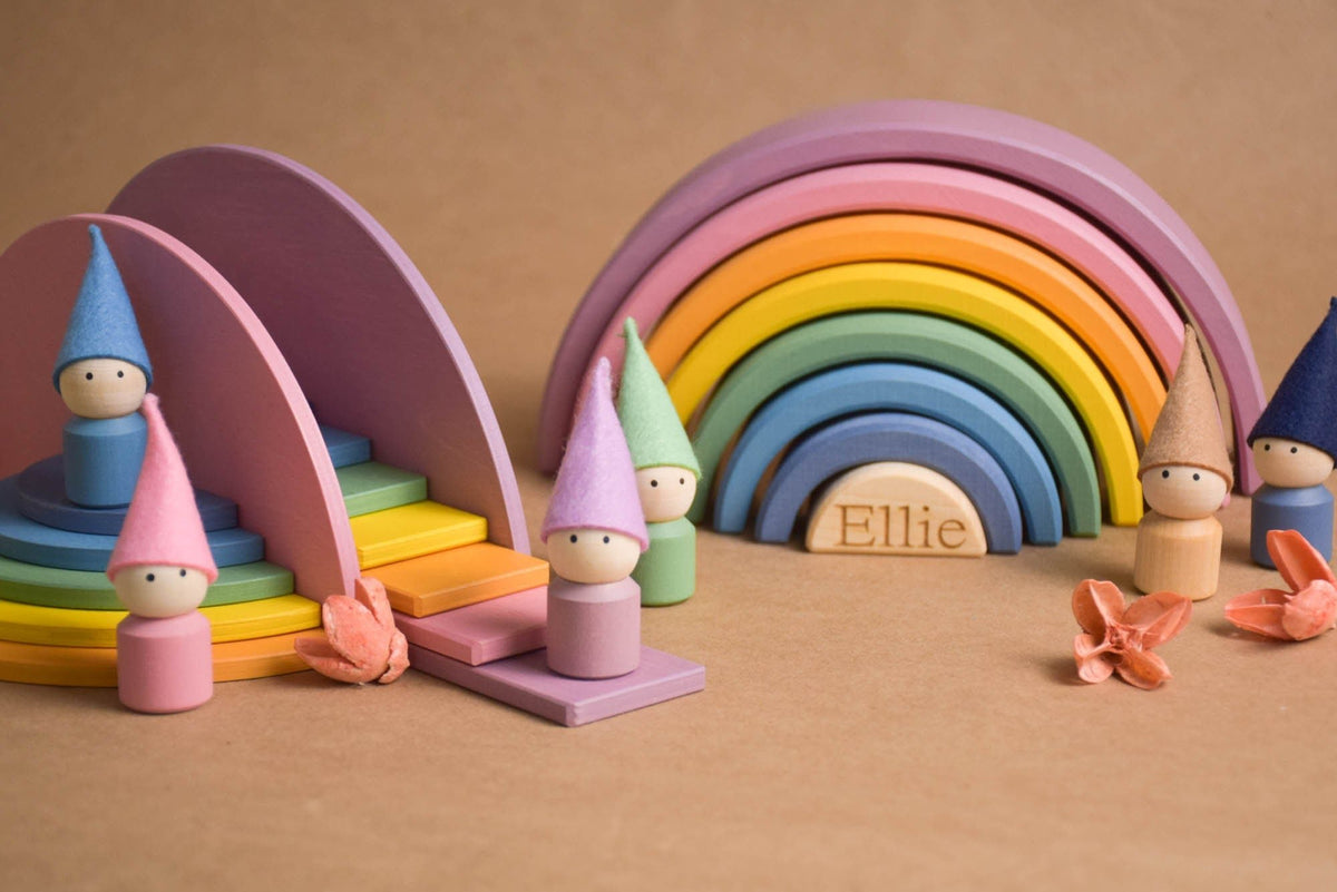 Handmade Montessori pastel rainbow building toy in wood and plywood with a natural wax-and-oil finish