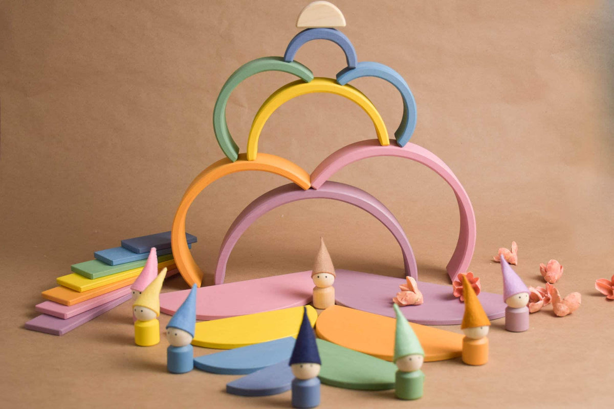 Handmade Montessori pastel rainbow building toy in wood and plywood with a natural wax-and-oil finish