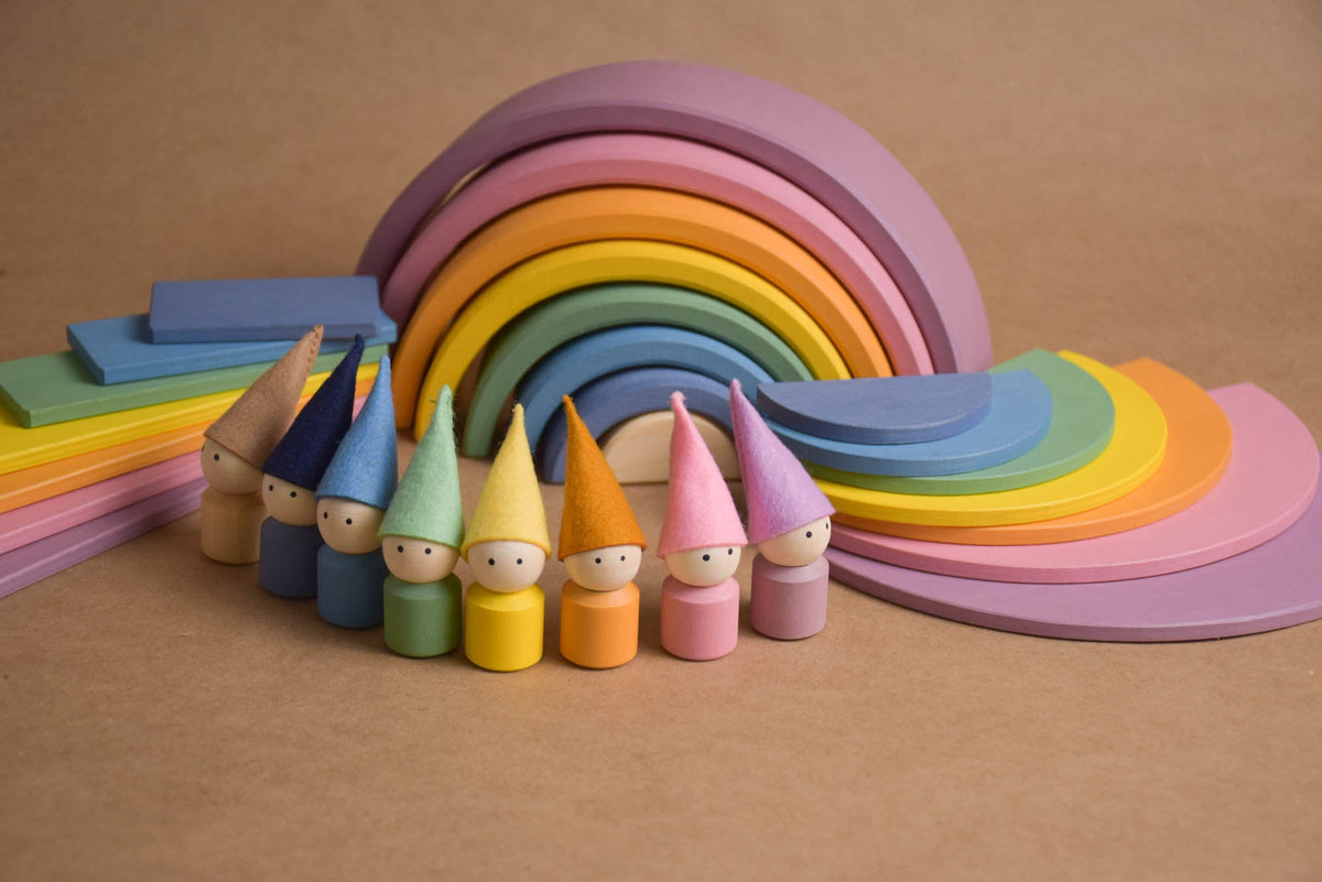 Handmade Montessori pastel rainbow building toy in wood and plywood with a natural wax-and-oil finish